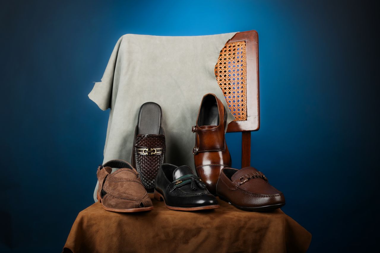 Stylish collection of men's leather dress shoes on a chair, perfect for fashion and formal occasions.